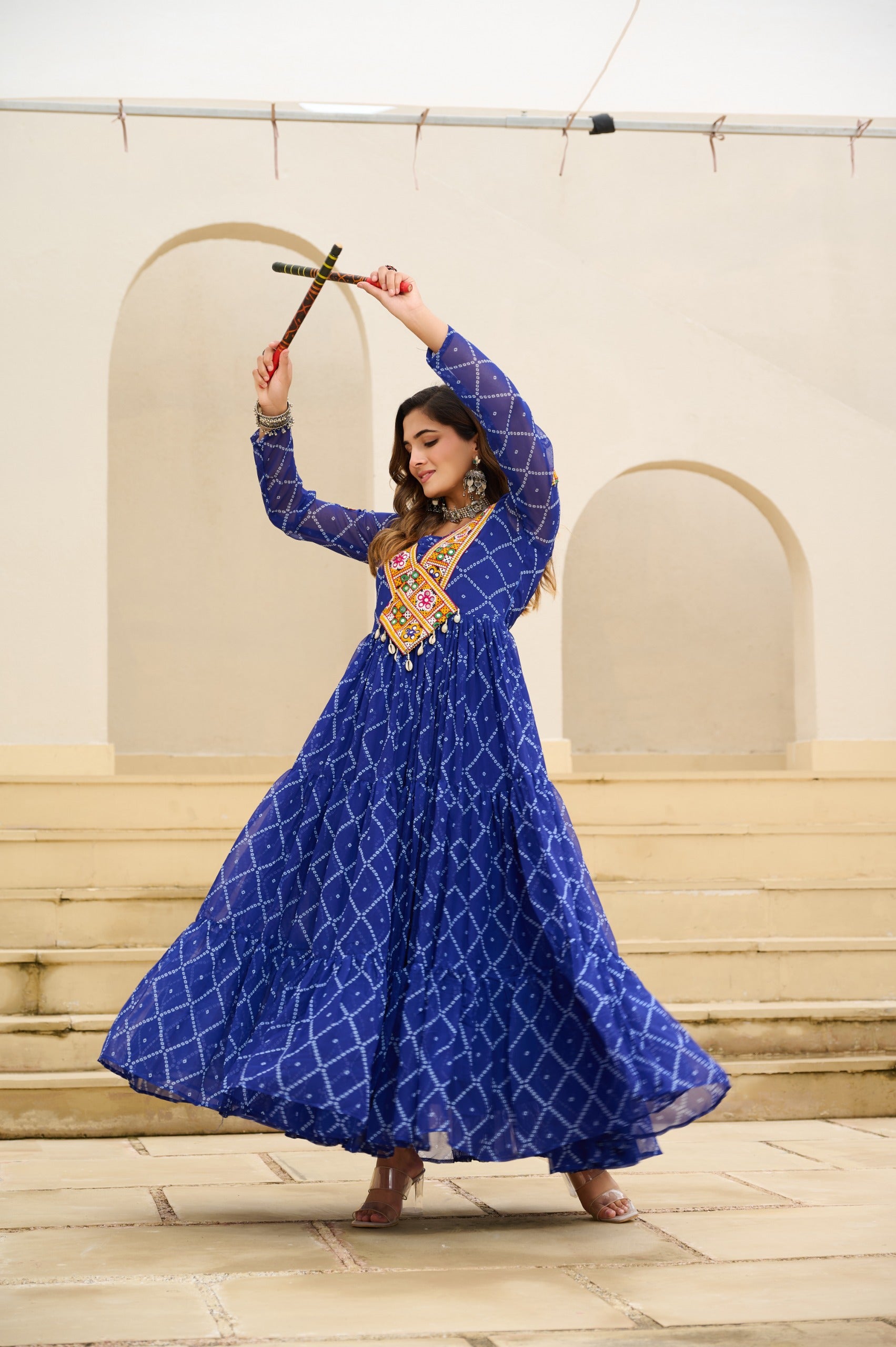 Blue faux georgette bandhani gown for festive wear