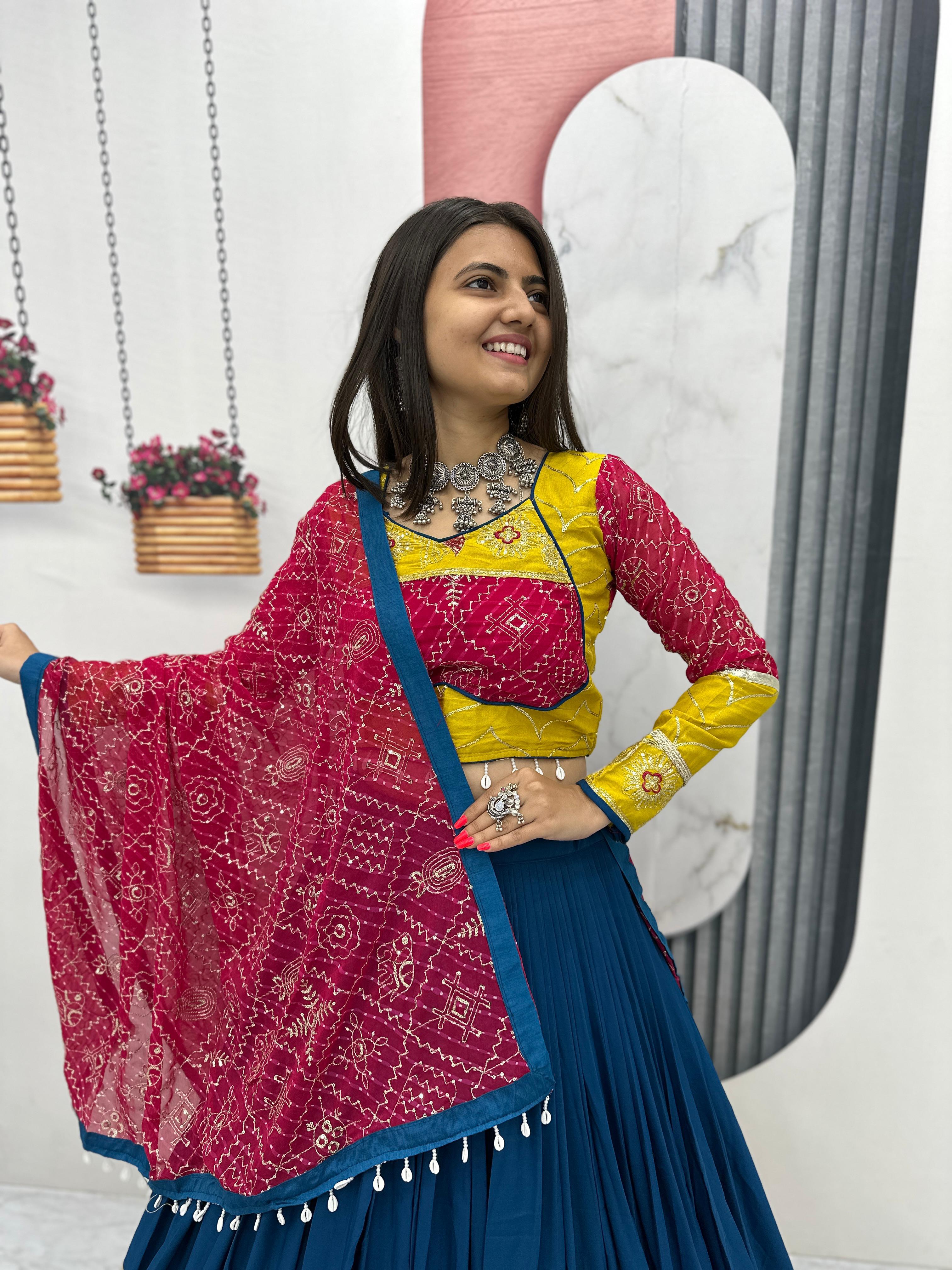 Model wearing embroidered blue-yellow lehenga set with red dupatta