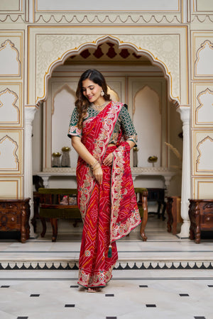 Full-length view of red Bandhani saree with embroidered border and unstitched blouse piece