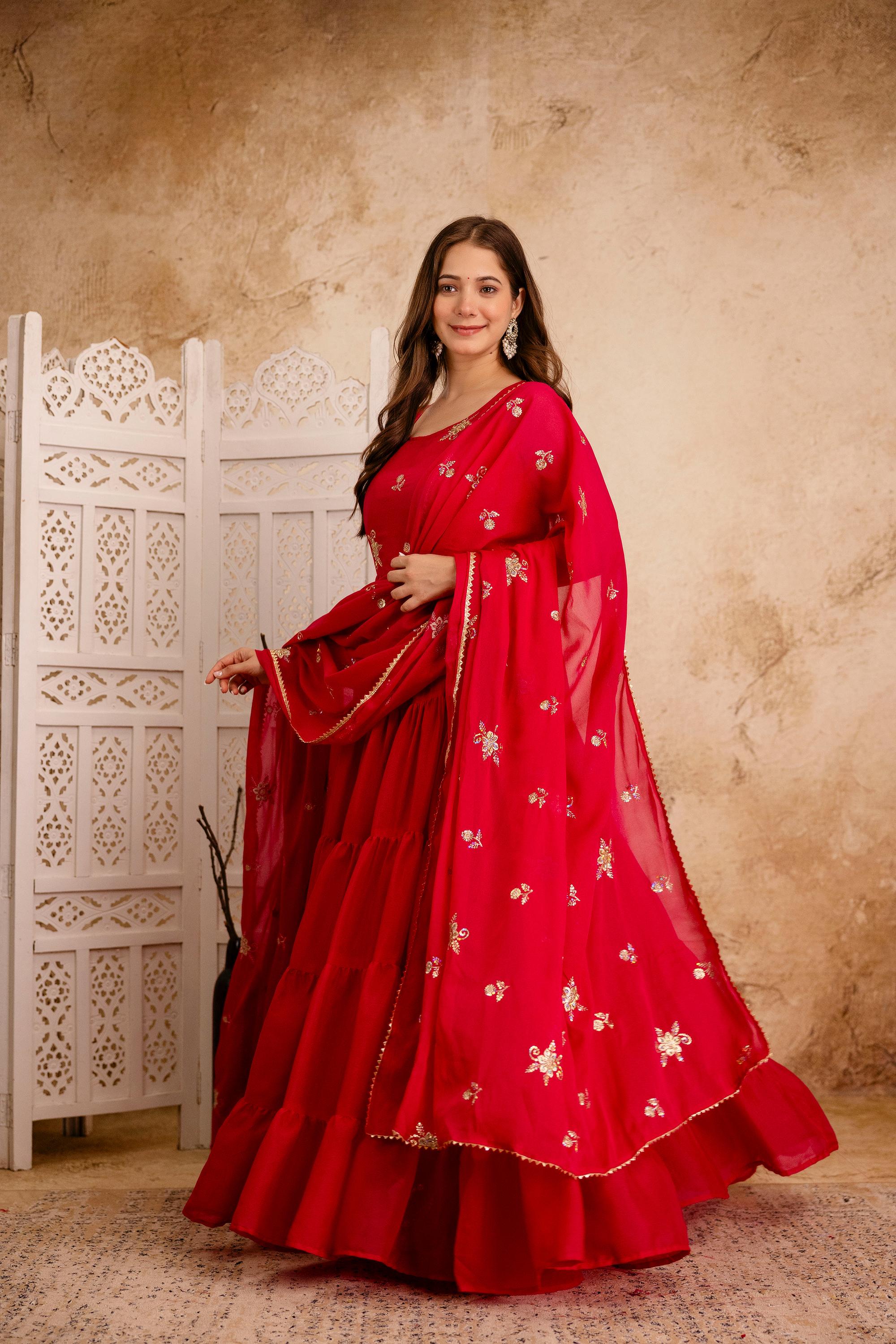 Front view of red heavy georgette embroidered Anarkali gown set