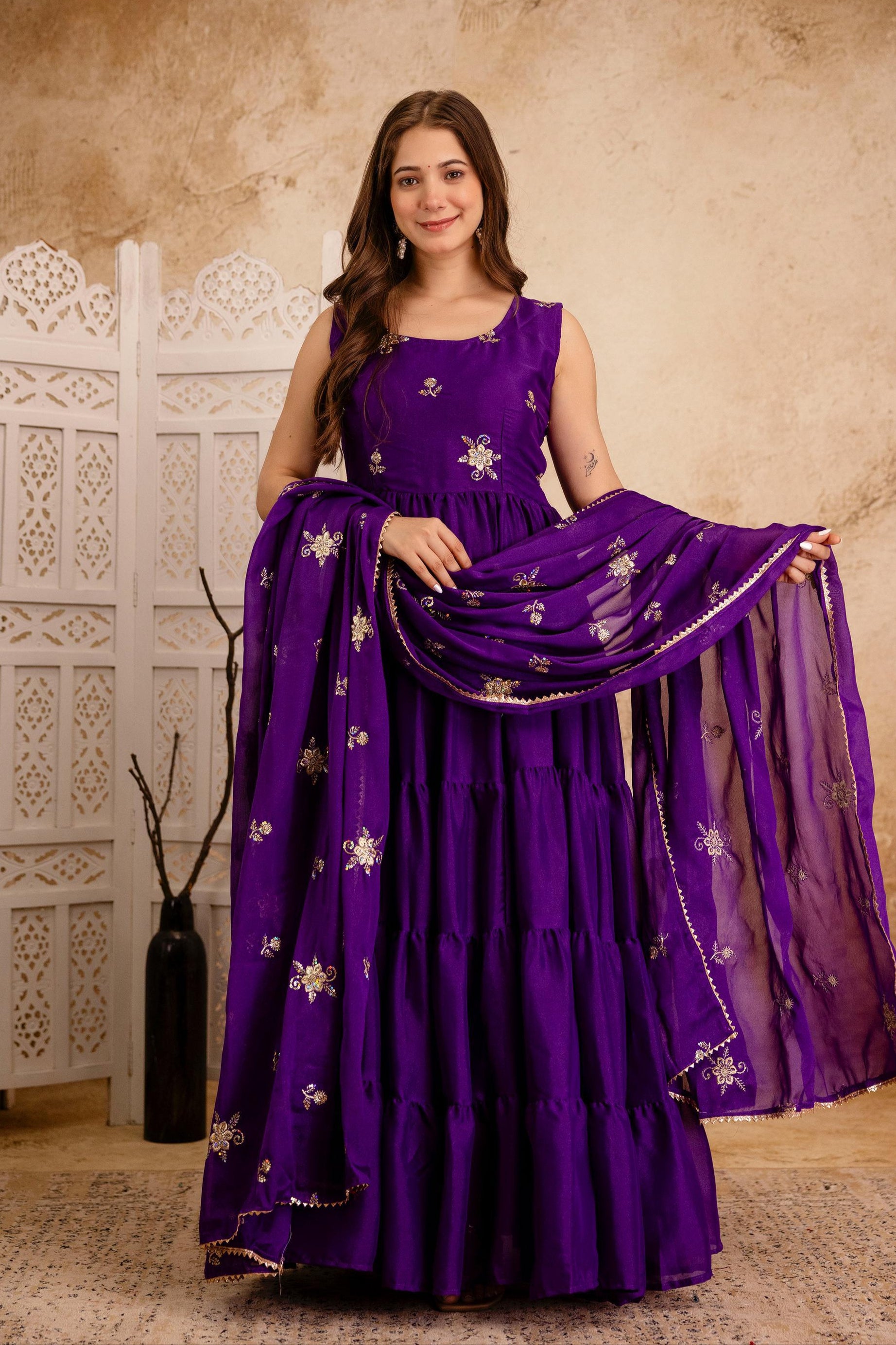 Indian woman wearing royal purple triple flair Anarkali dress