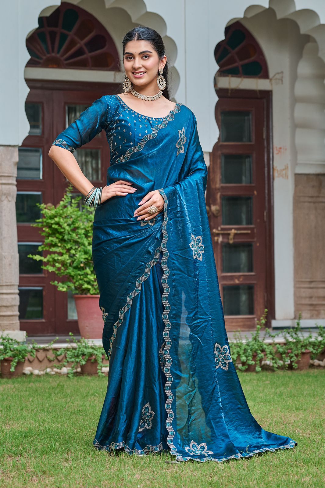 Woman wearing royal blue Fendy silk saree with diamond work