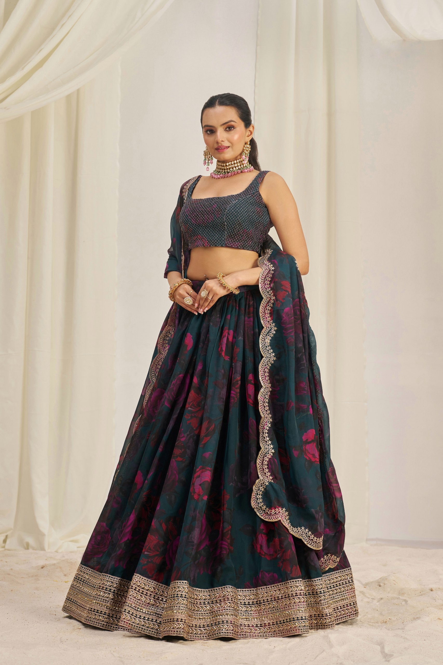 Full view of green floral organza lehenga with zari and sequin work