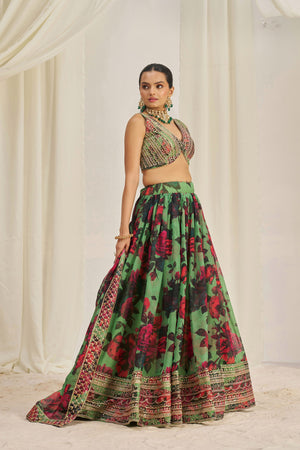 Model showcasing front pose in designer green lehenga