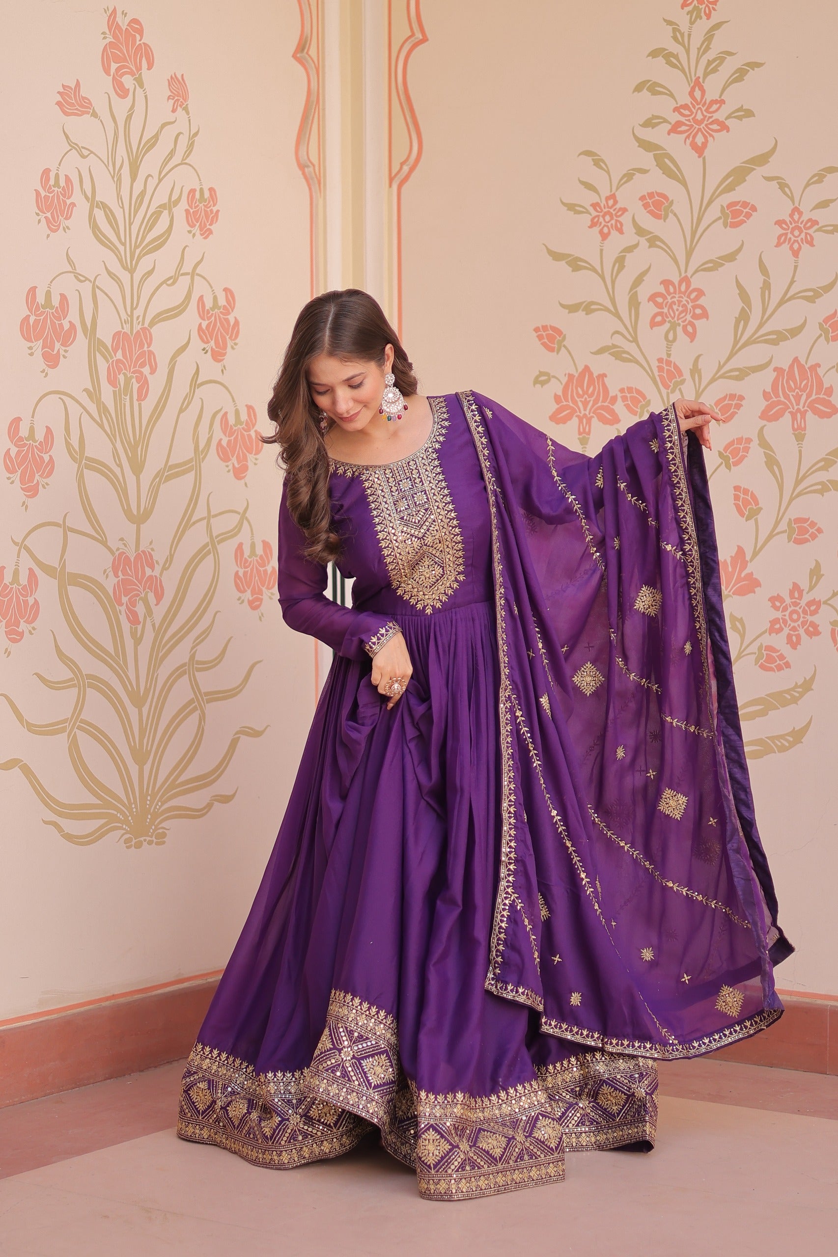Star Georgette purple color gown with full-sleeve and embroidered work for parties