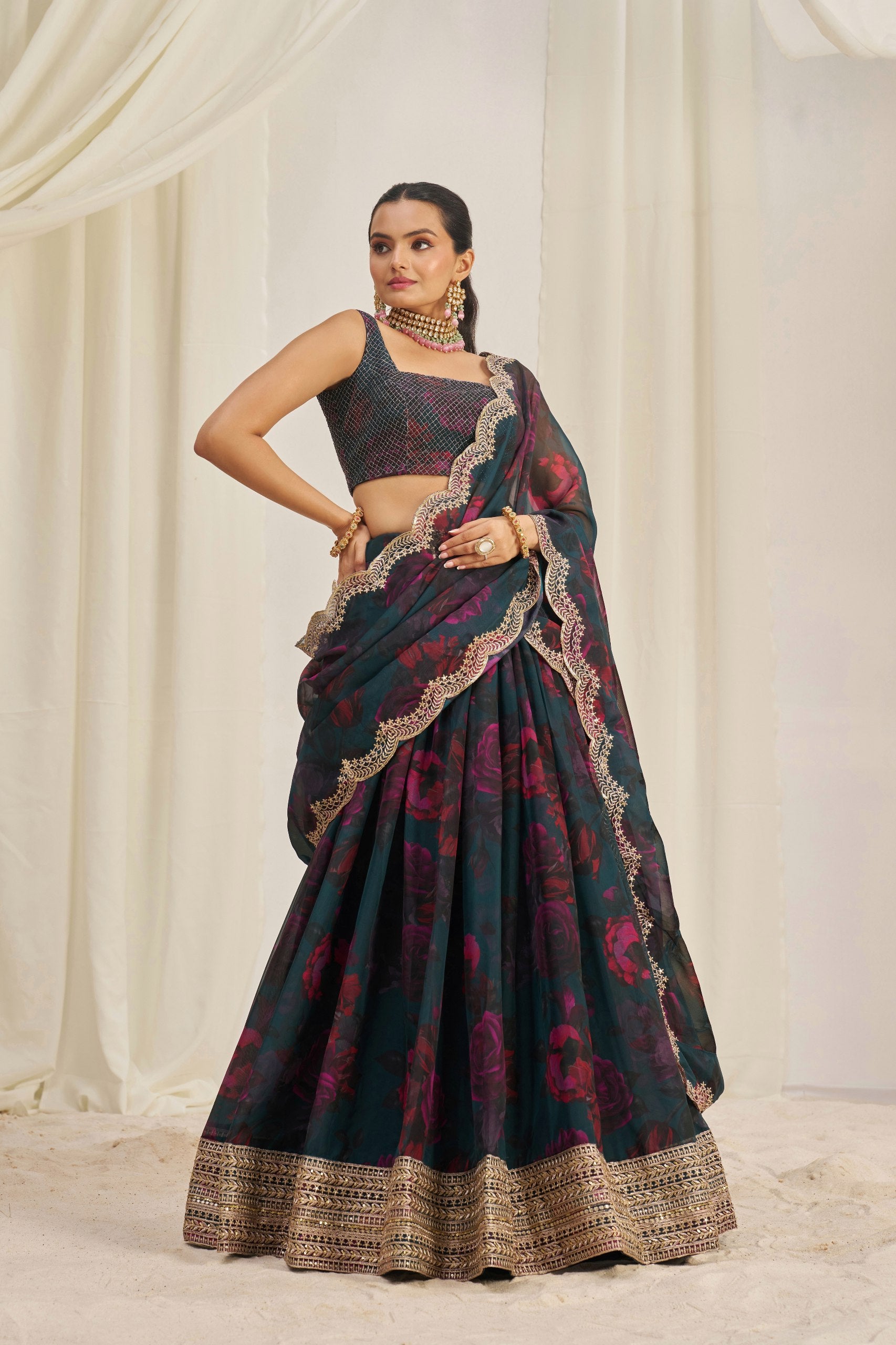Model posing in complete organza lehenga outfit