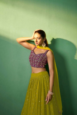 Close-up of sequins embroidery on green lehenga