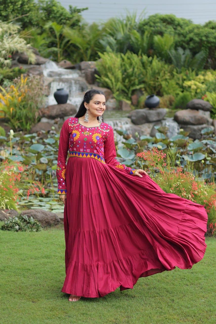 Model wearing maroon full flair gamthi work gown