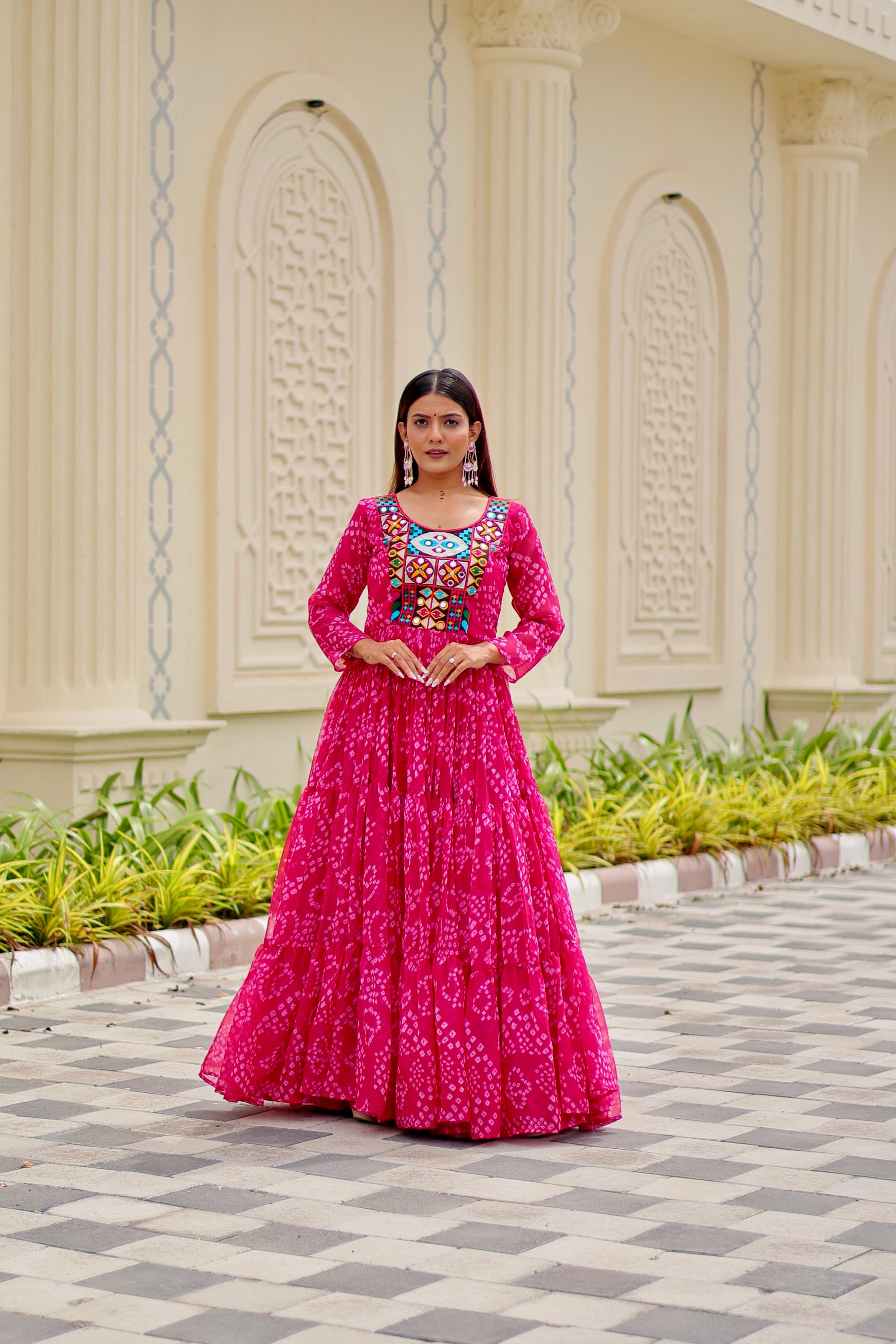 Model wearing Vastralyn Bandhani print gown in Pink