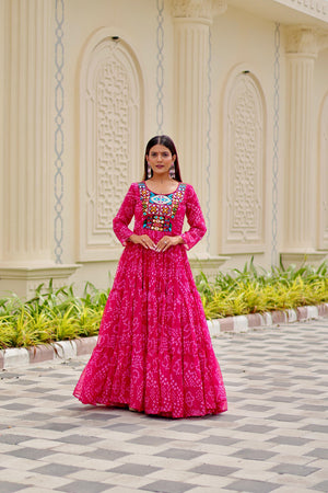 Model wearing Vastralyn Bandhani print gown in Pink