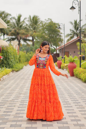 Model wearing Vastralyn Bandhani print gown in Orange