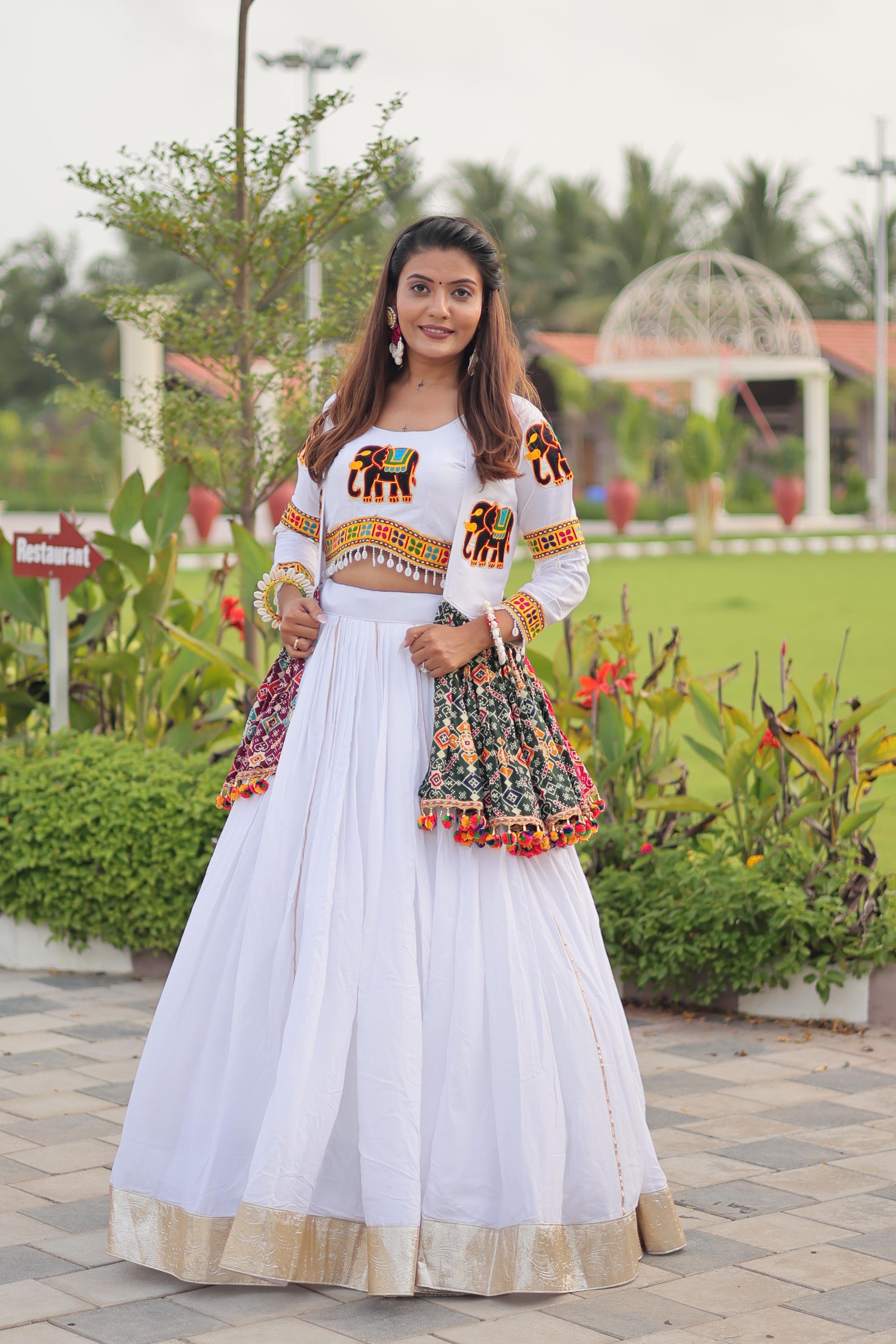 White lehenga with heavy Gamthi embroidery