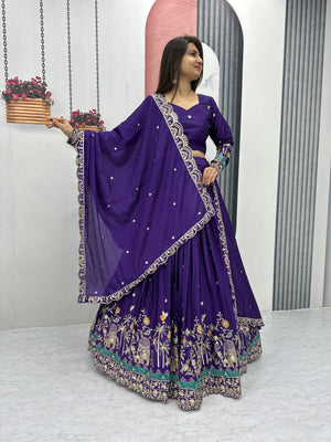 Woman in a purple traditional outfit with floral patterns on a white background