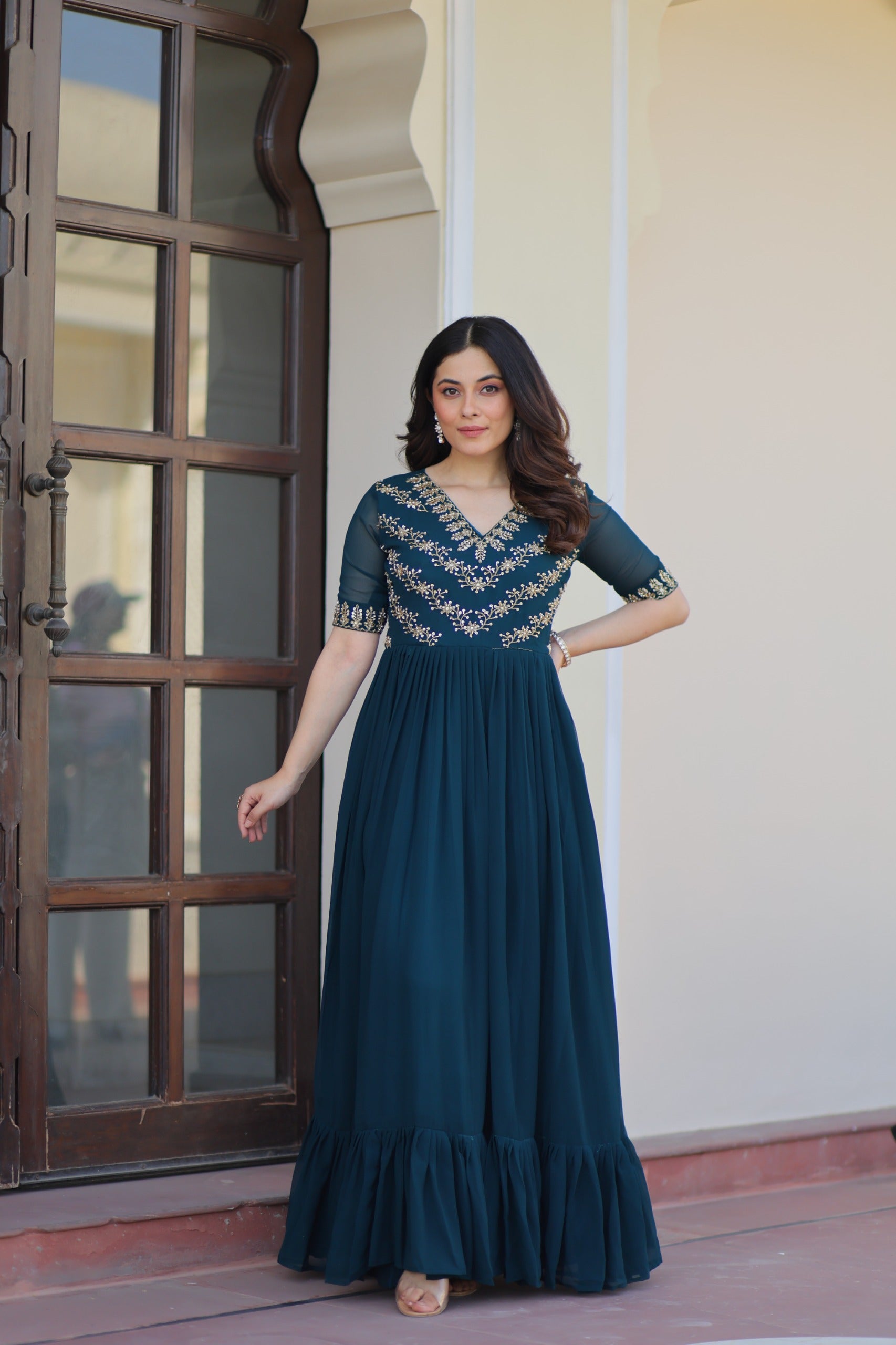 Rama green embroidered gown with frill flair and cotton inner – Vastralyn