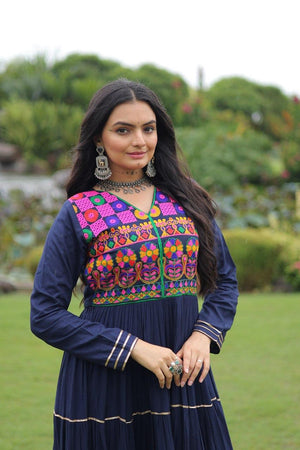 Close-up of mirror handwork on traditional gown