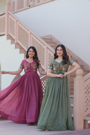 Two women in traditional outfits standing on a staircase.