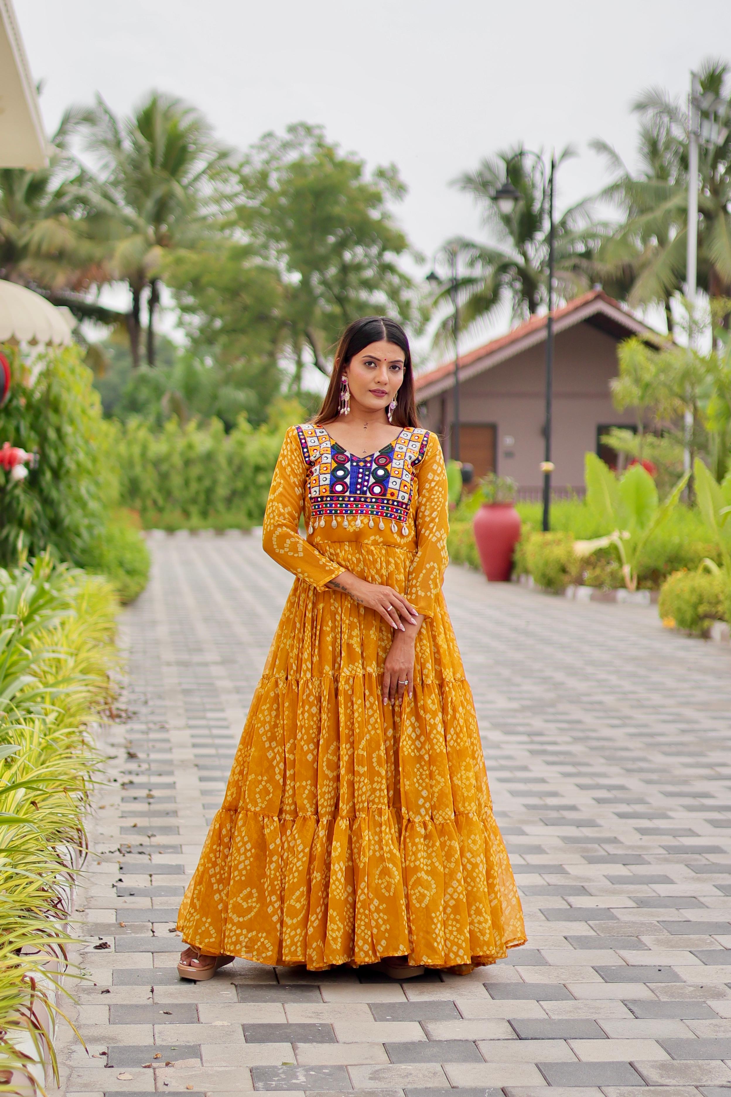 Yellow gown with embroidery and mirror work