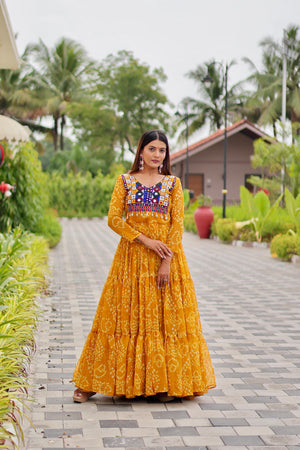 Yellow gown with embroidery and mirror work