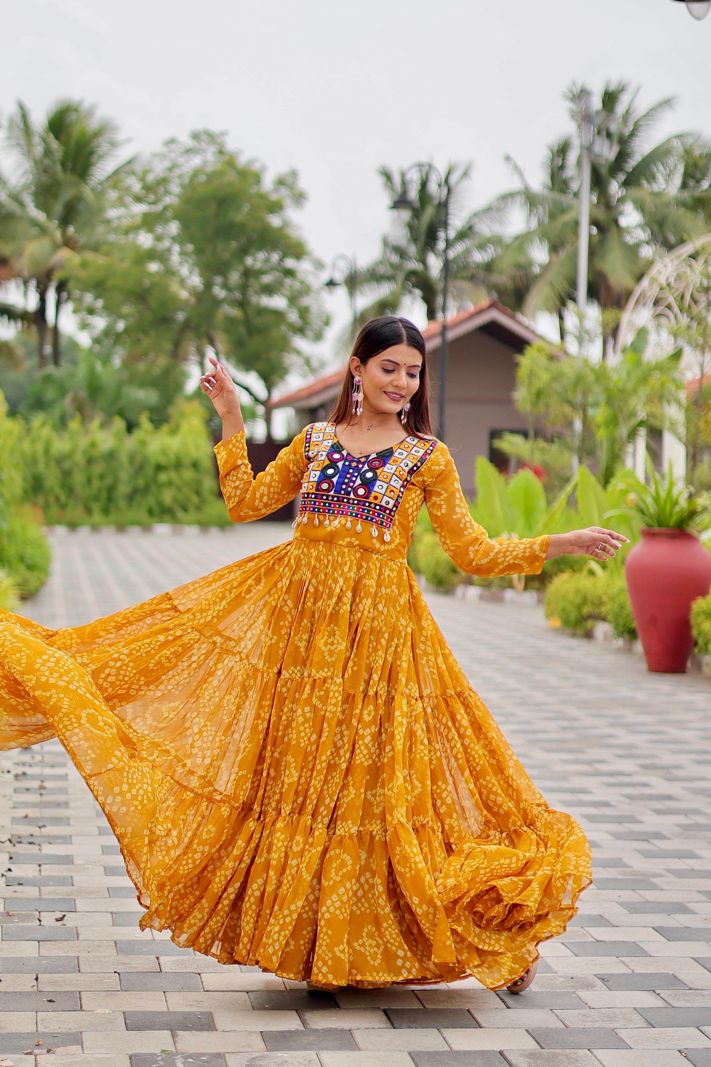 Yellow gown with embroidery and mirror work