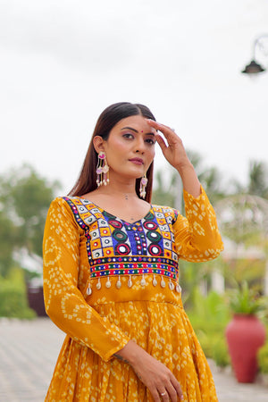 Yellow faux georgette embroidered mirror work gown front view