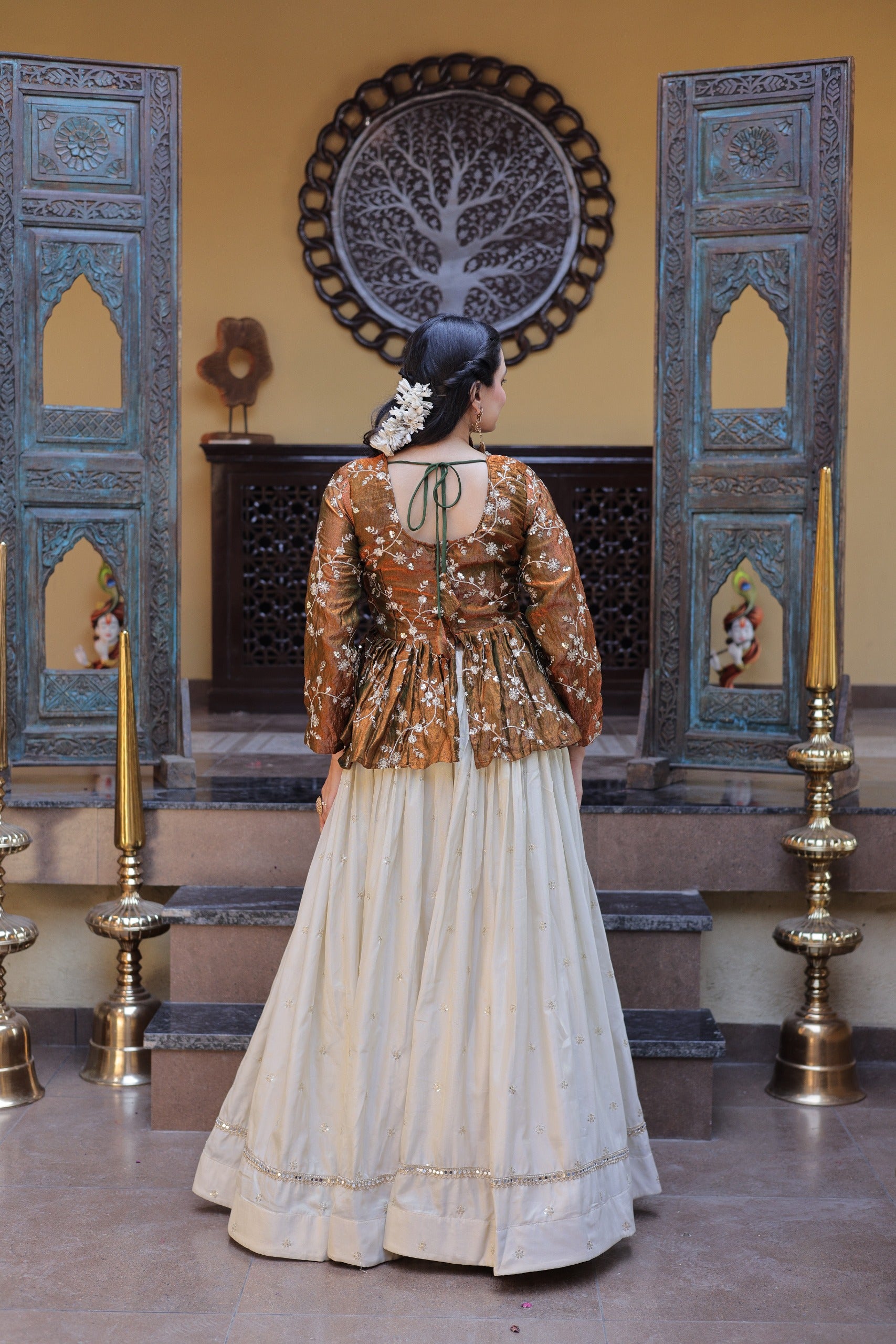 This designer lehenga with crop top is ideal for party wear and special occasions with stylish peplum blouse design.