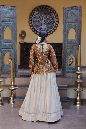 This designer lehenga with crop top is ideal for party wear and special occasions with stylish peplum blouse design.