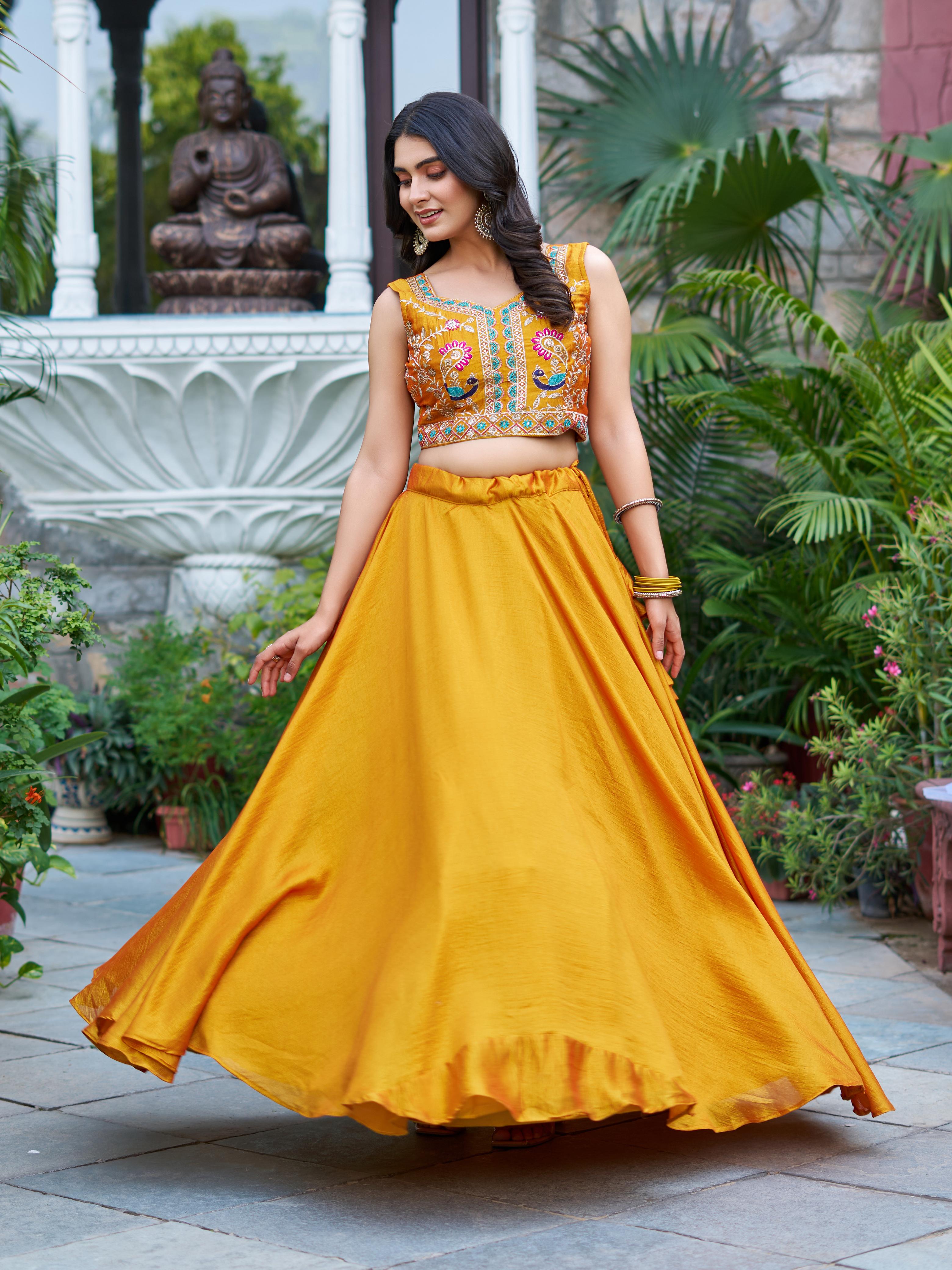 Woman in a yellow traditional outfit Festive Wear Lehenga