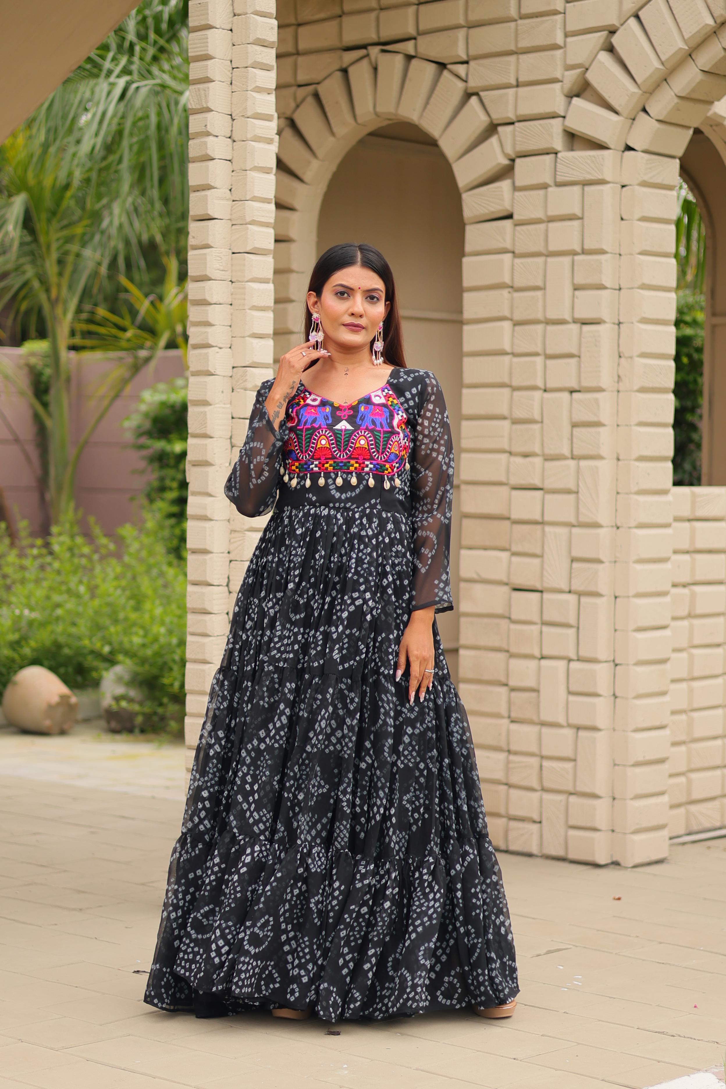 Black faux georgette gown with real mirror work close-up

