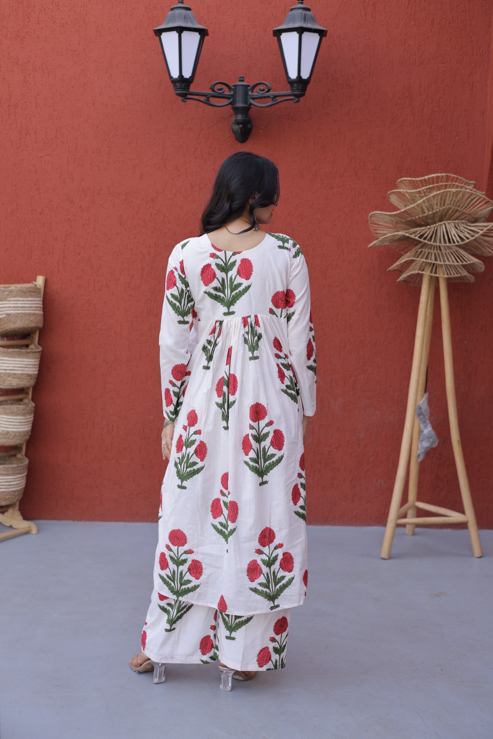 Comfortable long kurti with pant set featuring traditional floral prints perfect for daily use.