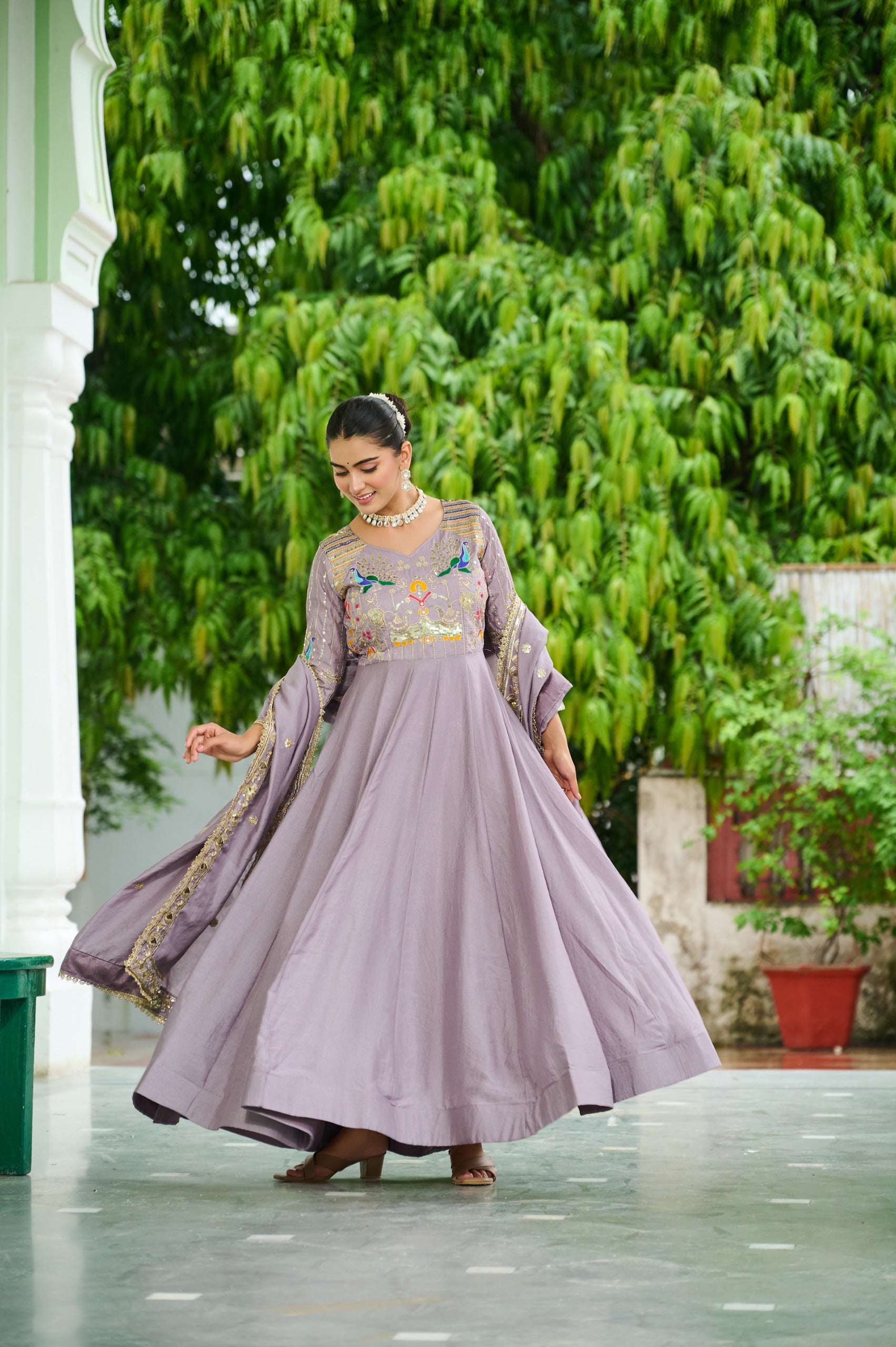 Women wearing embroidered Vichitra Silk gown with dupatta
