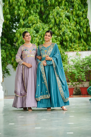 Women wearing embroidered Vichitra Silk gown with dupatta