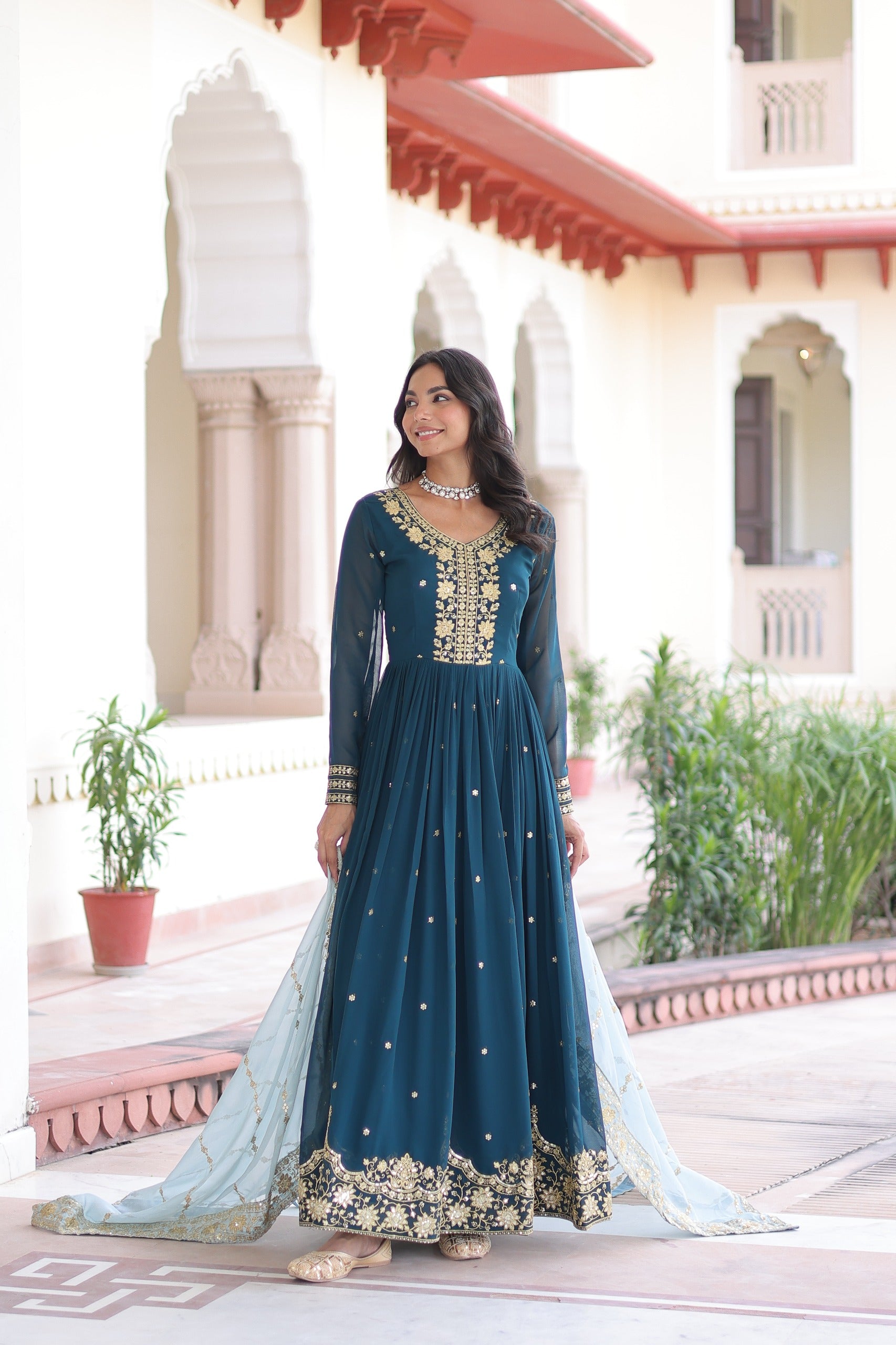 Designer teal blue gown with zari embroidery