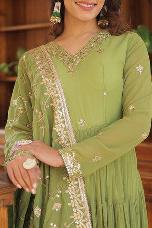 green embroidered gown