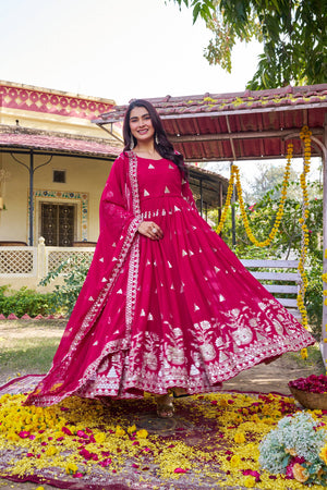Full pink flared gown with dupatta flowing beautifully 