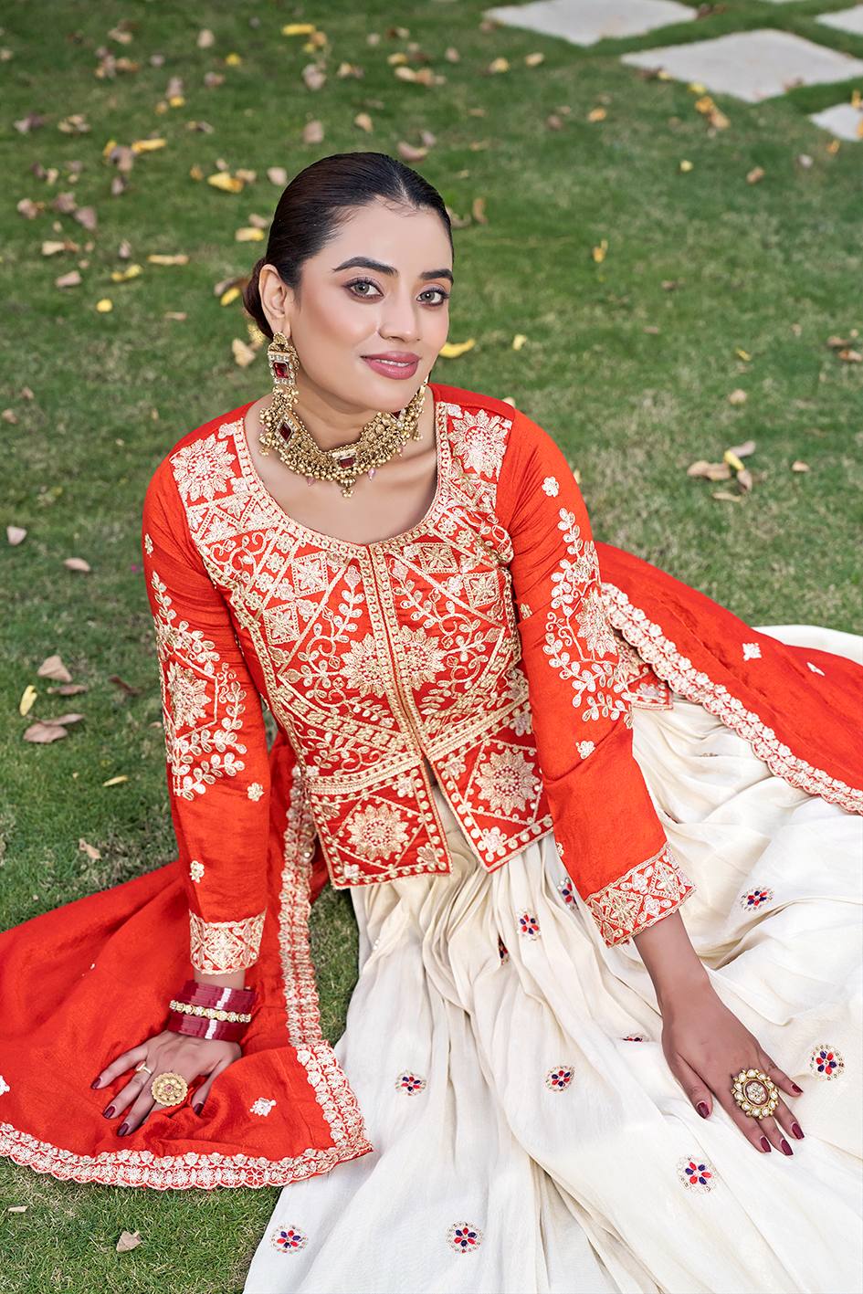 This stylish lehenga choli for women is ideal for wedding events and celebrations with its flowing flare and rich design.