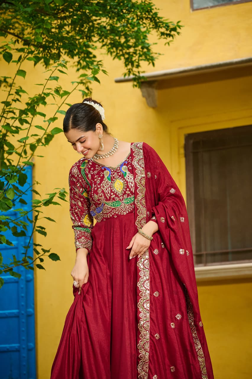 Elegant Maroon Vichitra fabric gown with intricate zari embroidery and full sleeves