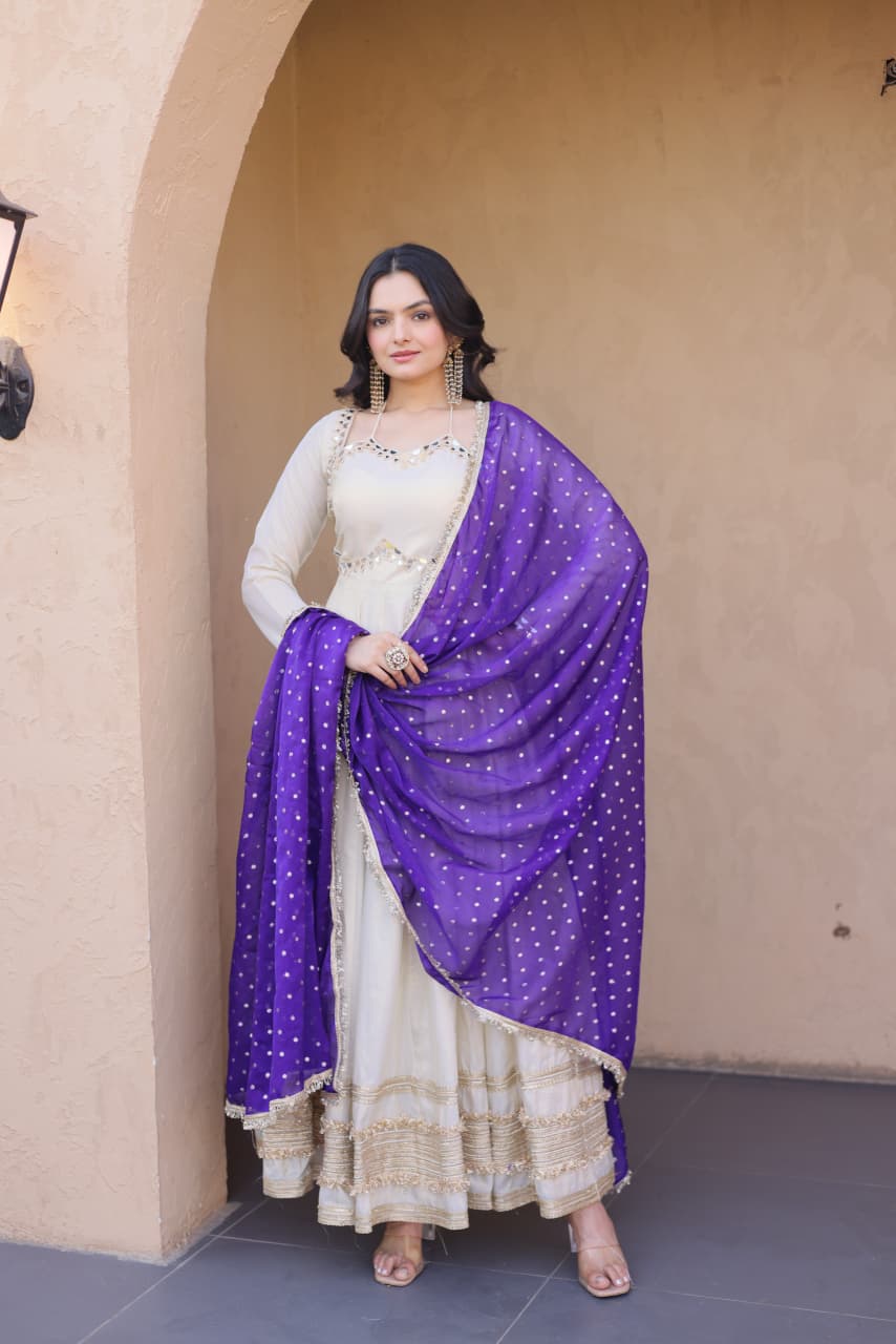 This mirror work gown is perfect for weddings, festive occasions, and party wear with elegant zari embroidery