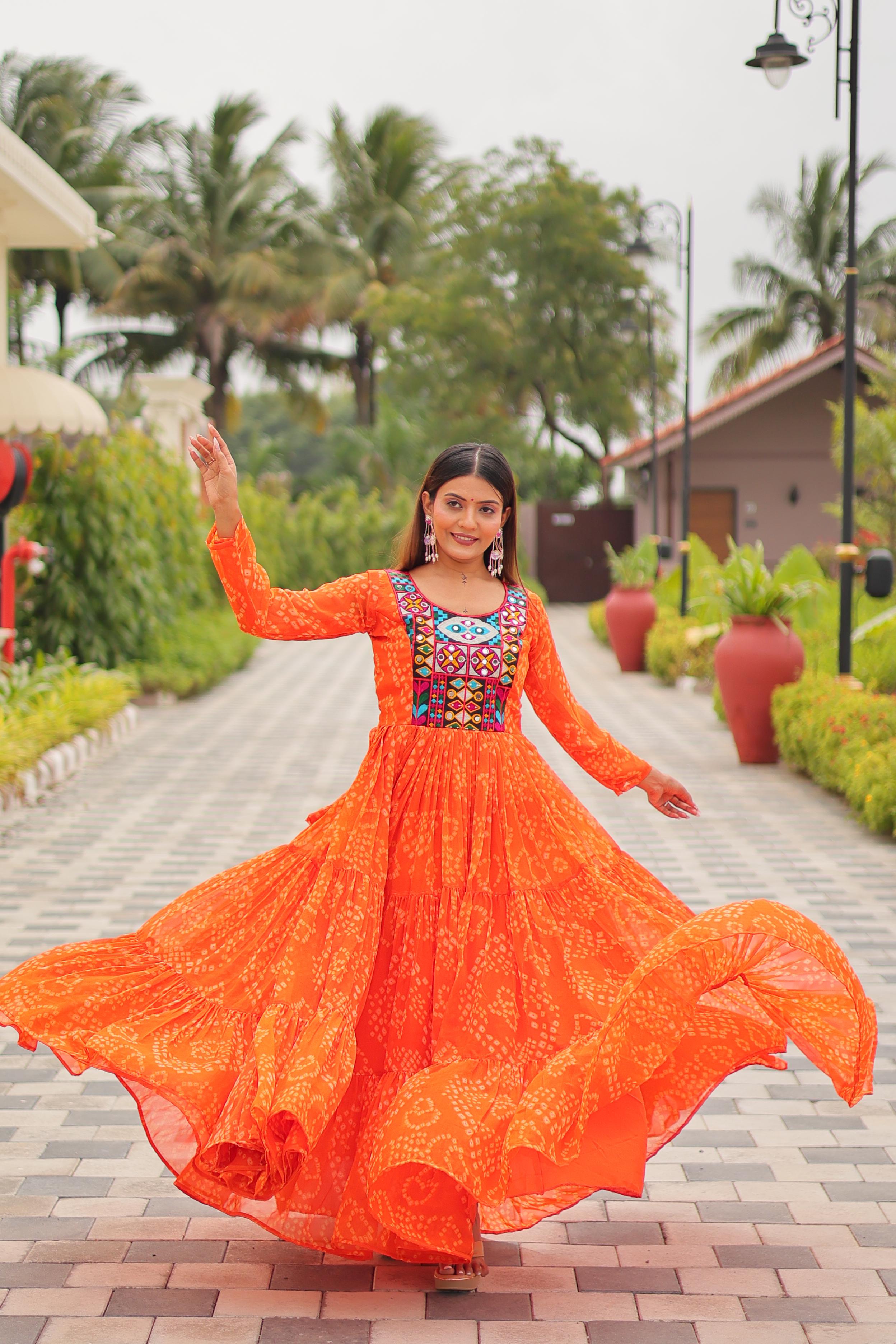 Orange Bandhani print gown with real mirror embroidery