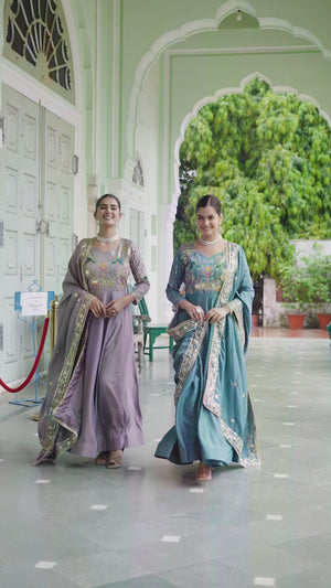 Women wearing embroidered Vichitra Silk gown with dupatta