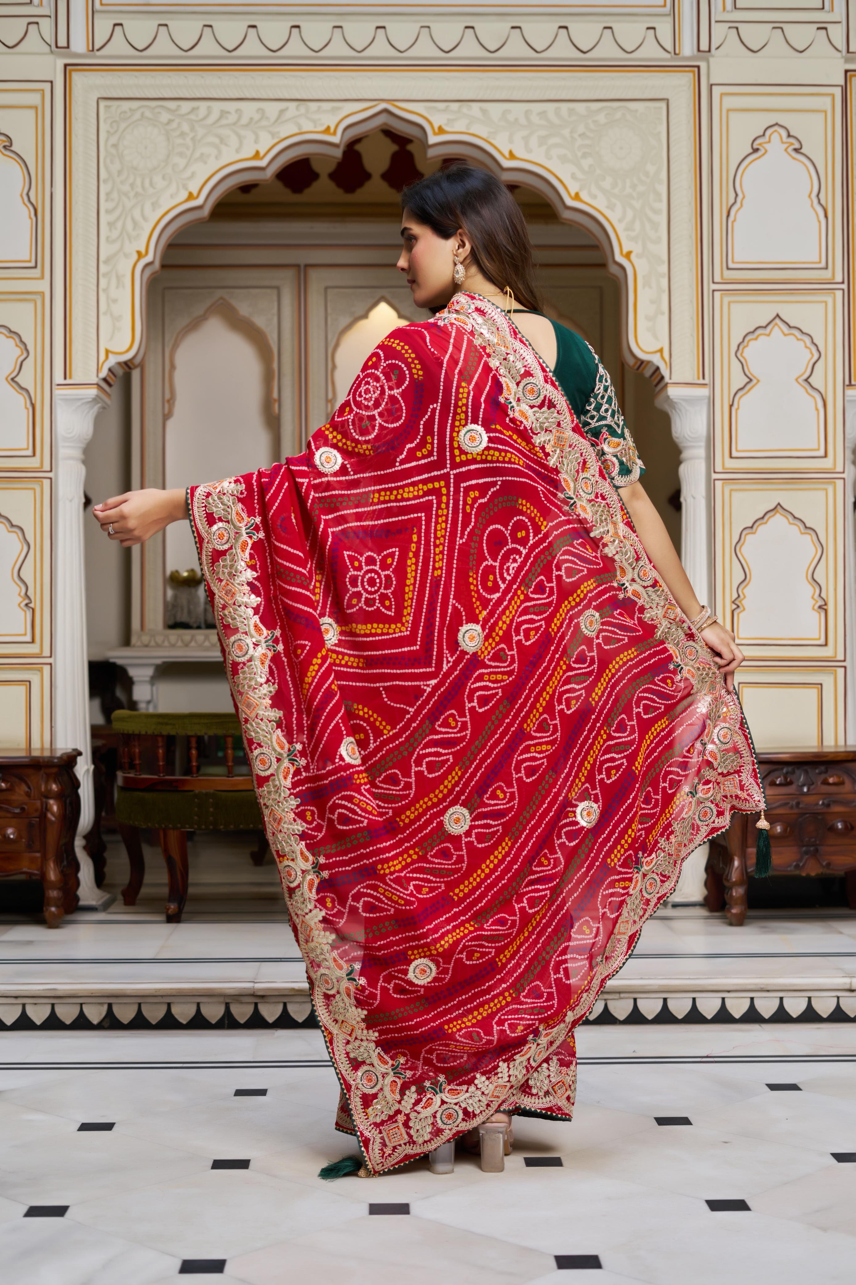 Model showcasing red traditional Bandhani saree with mono silk blouse piece