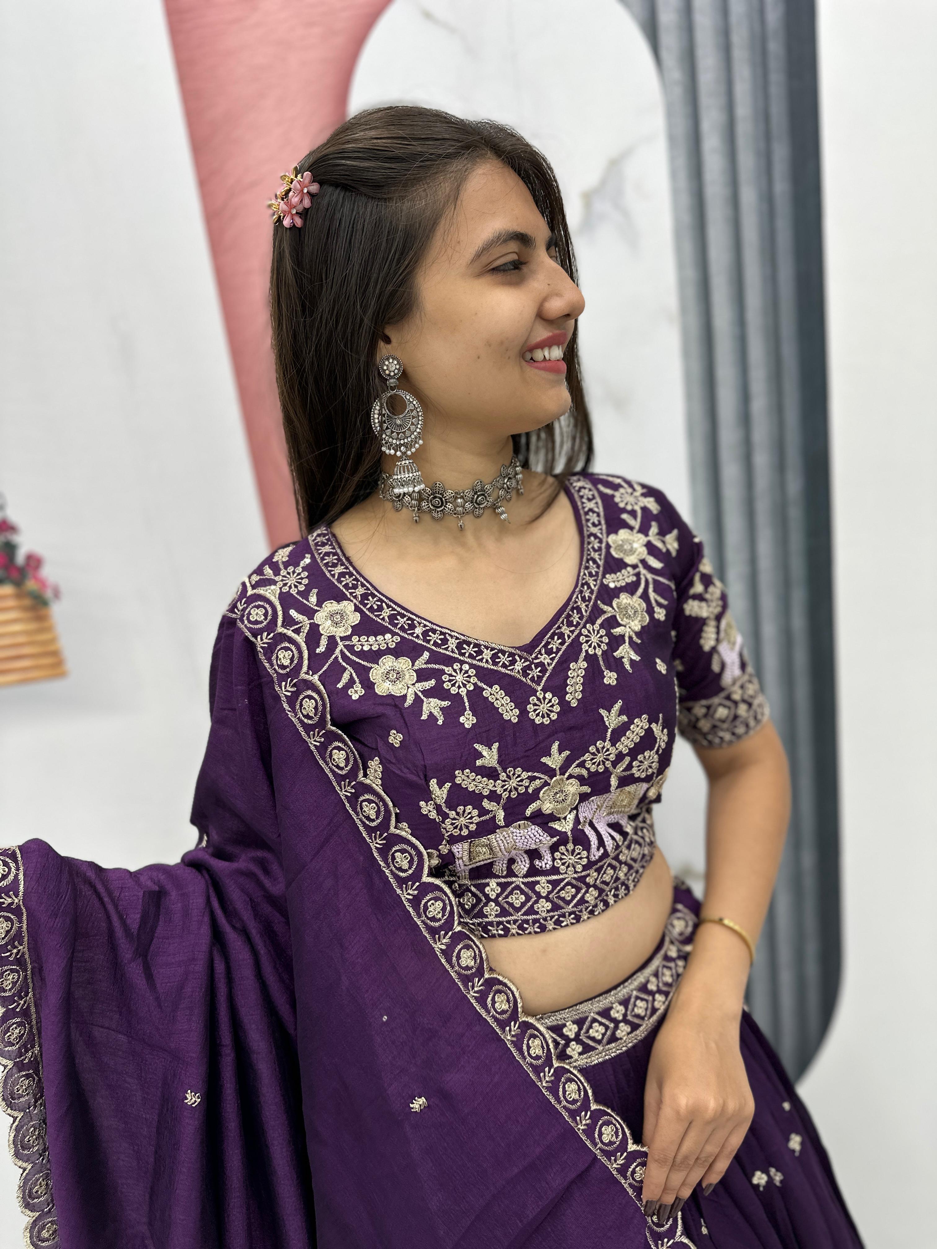 Close up of heavy thread embroidery on purple choli blouse