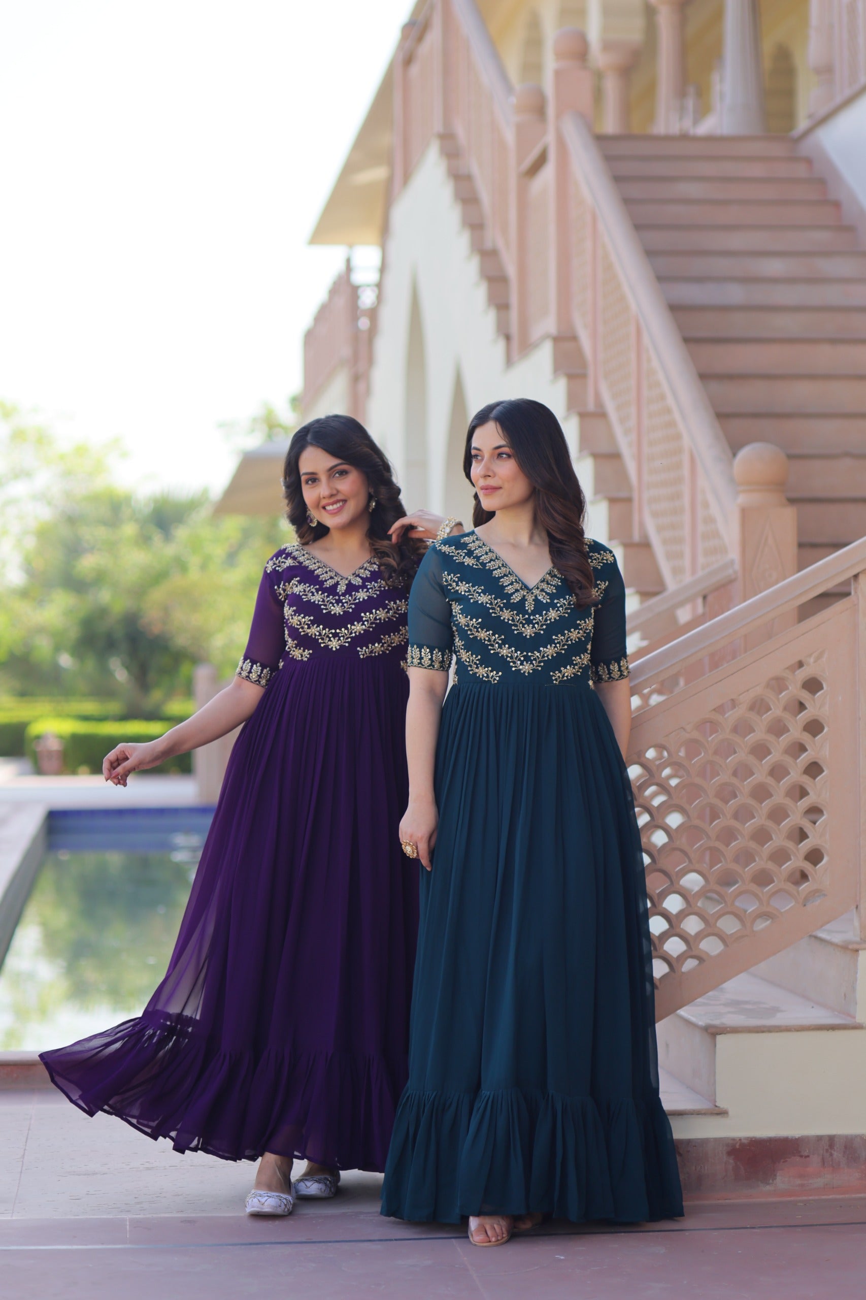 Model showcasing royal purple gown with frill flair and fancy neck