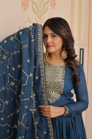 Rama color gown with sequins and Zari work for festive occasions