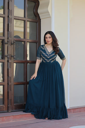 Flowing flair detail of Rama green gown with frill and lining