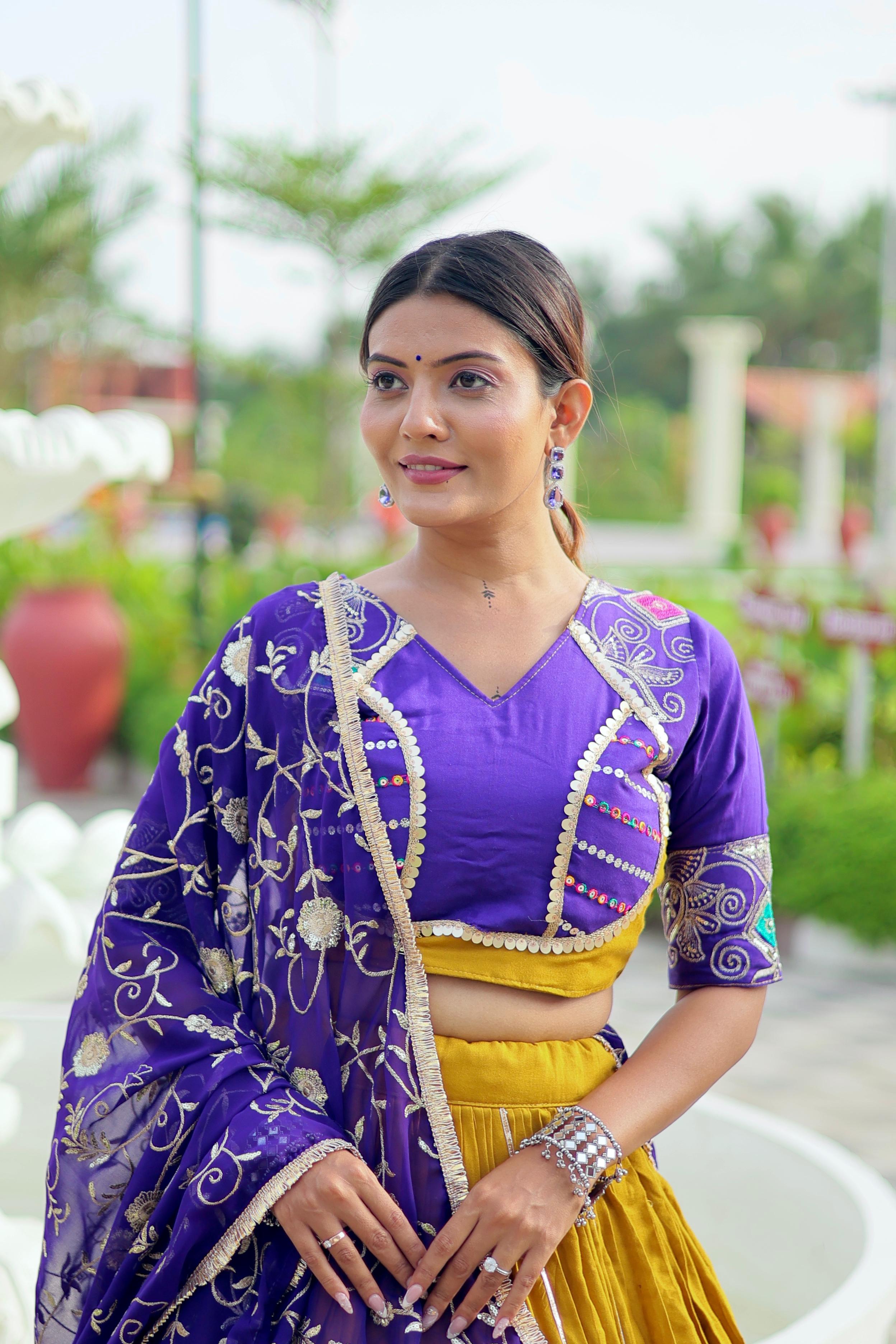 Heavy embroidery work choli in mustard and purple combination

