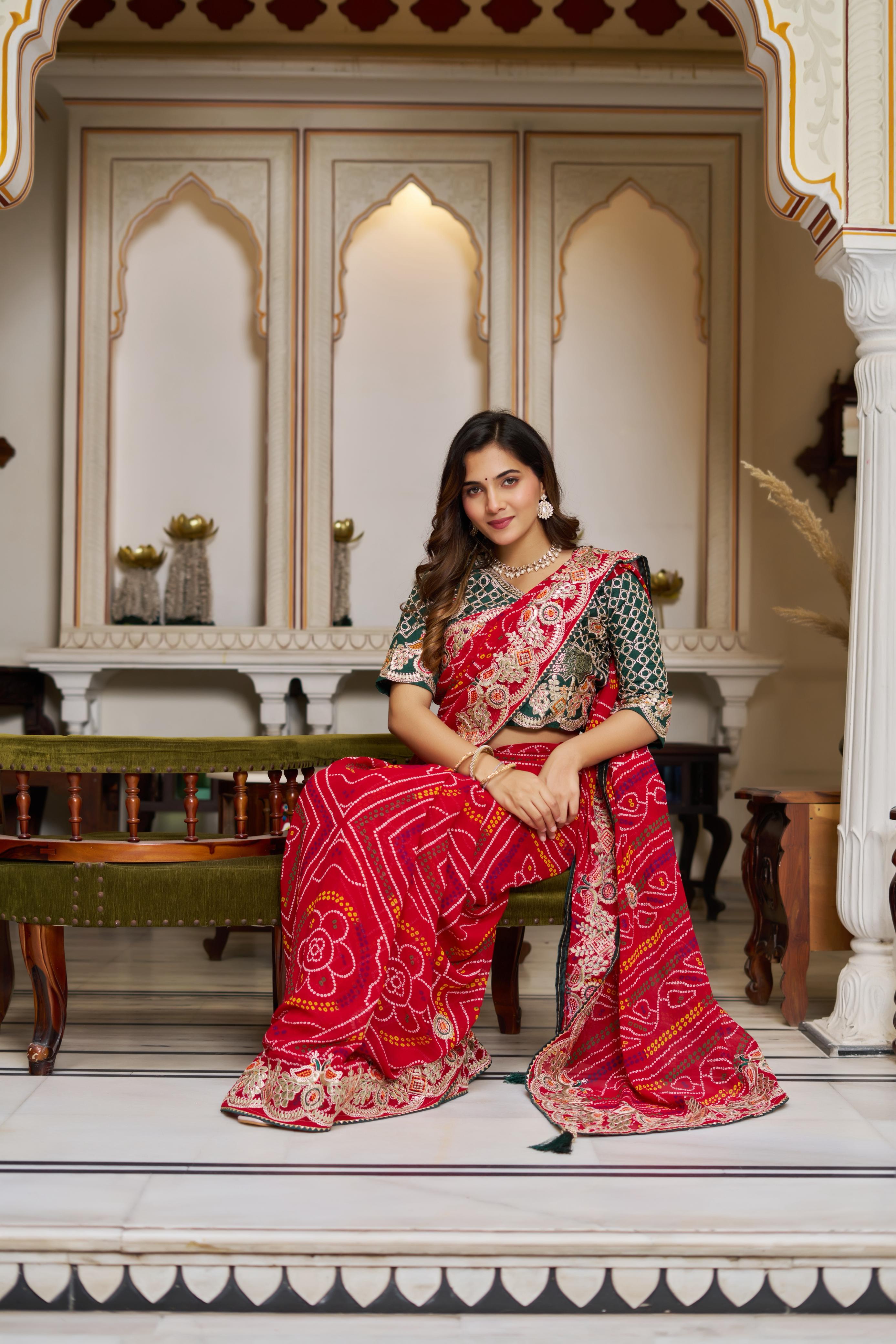 Festive ethnic look in pure Bandhej saree with handcrafted embroidery work