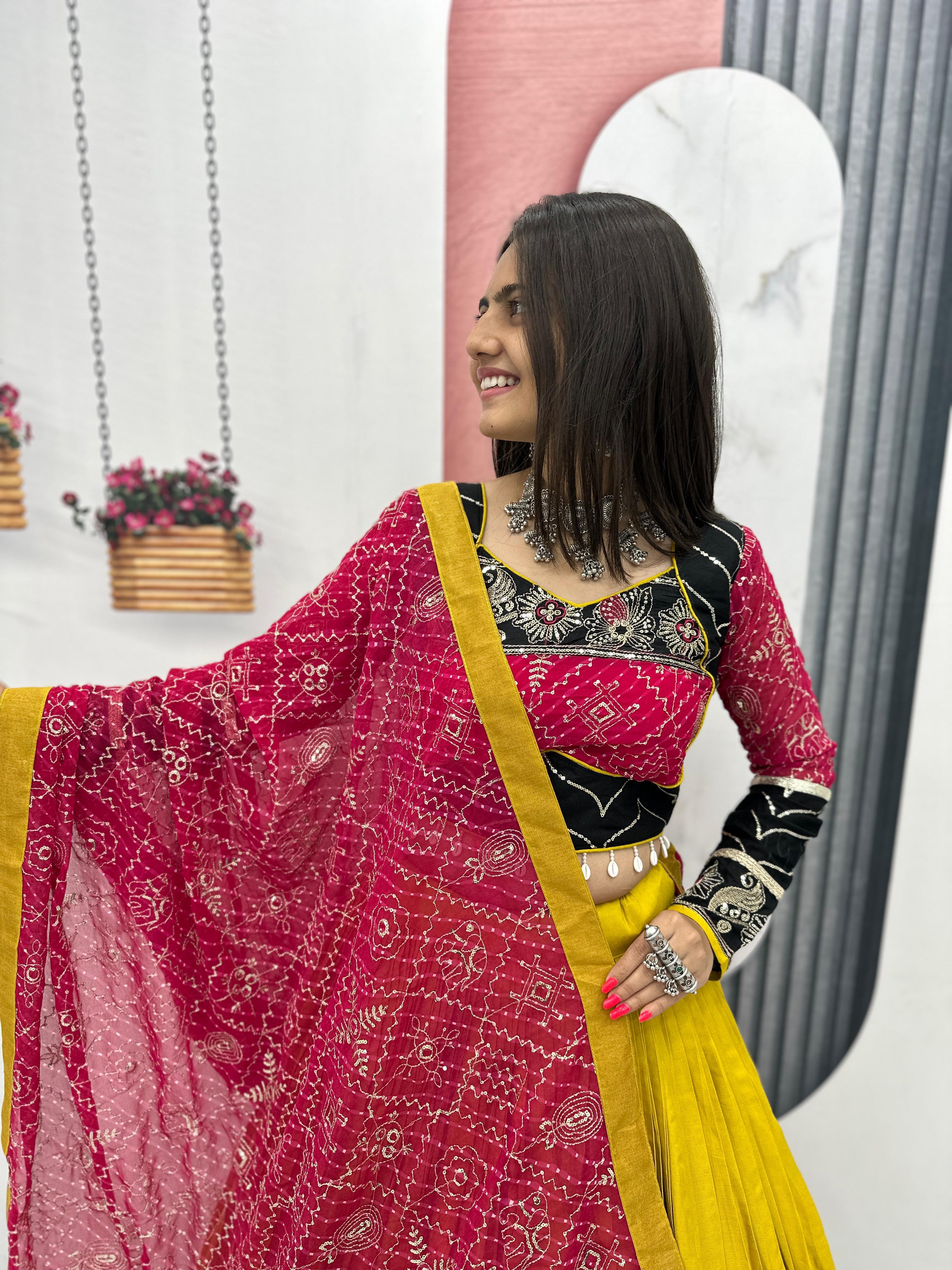 Close-up of choli embroidery and mirror work