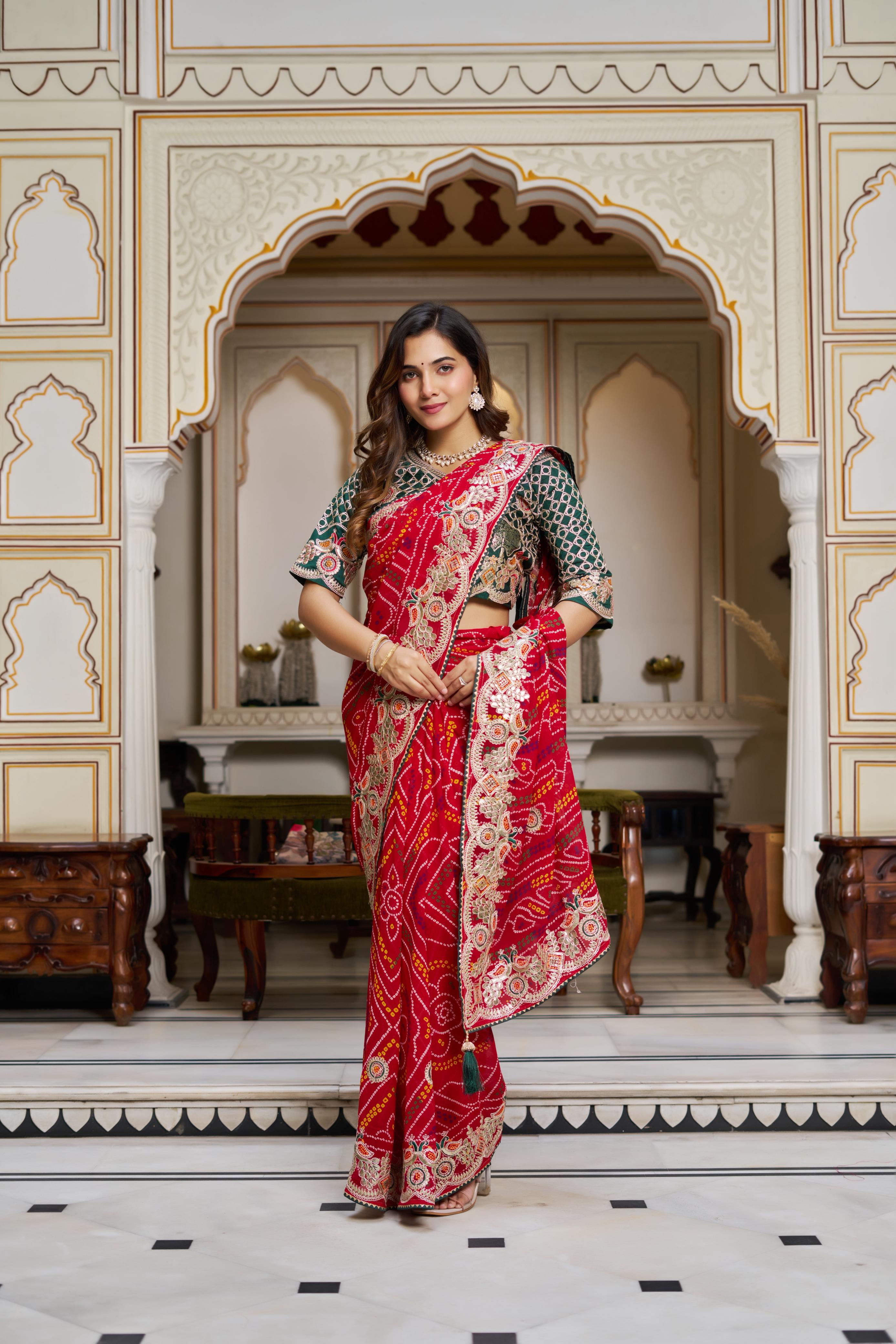 Elegant red Bandhej silk saree styled with jewelry for wedding functions