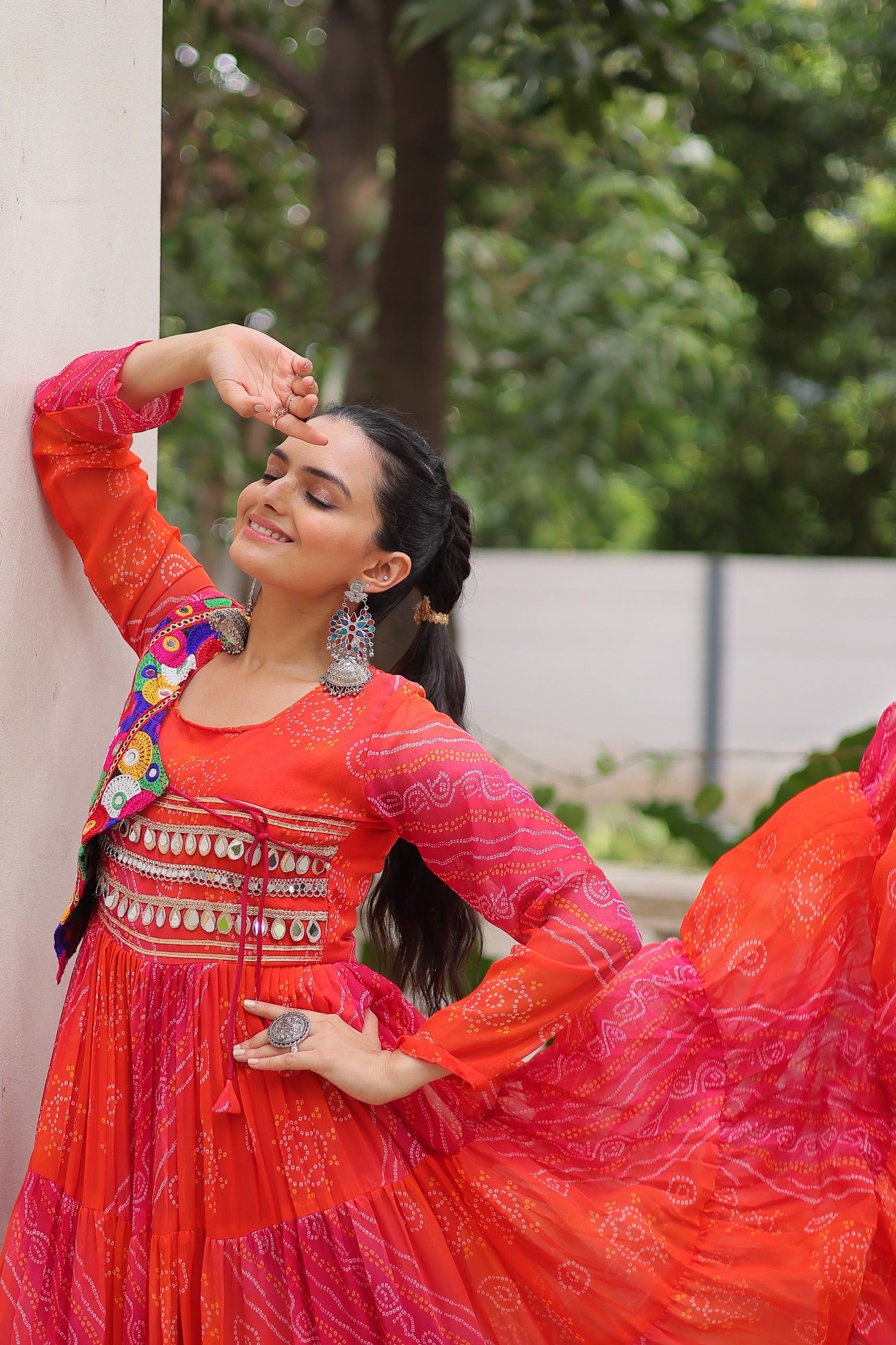 Close-up of Kutchi Patchwork Design on Red-Pink Gown