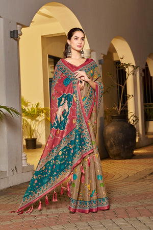 Beige saree with maroon tassels and folk artwork